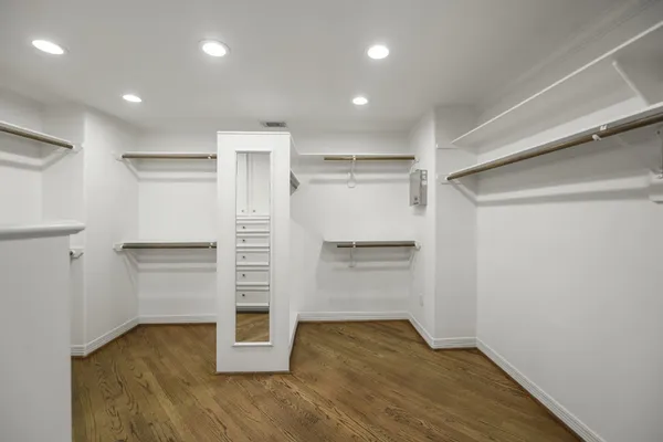 a view of an empty room with a closet