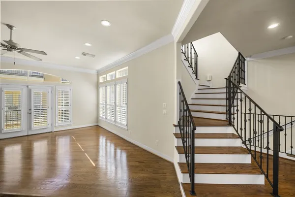 a view of entryway with wooden floor and stairs
