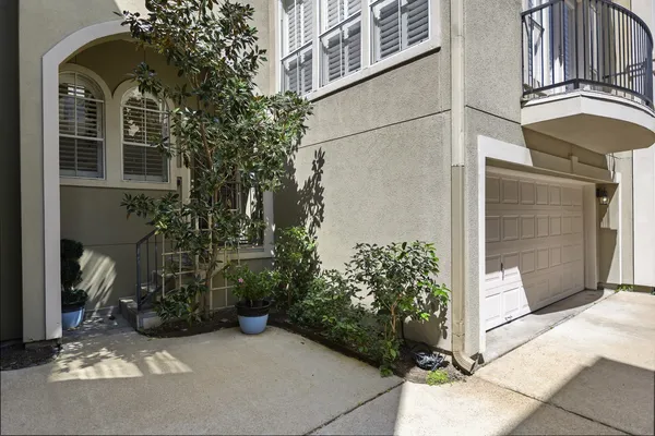 a view of a house with a flower garden