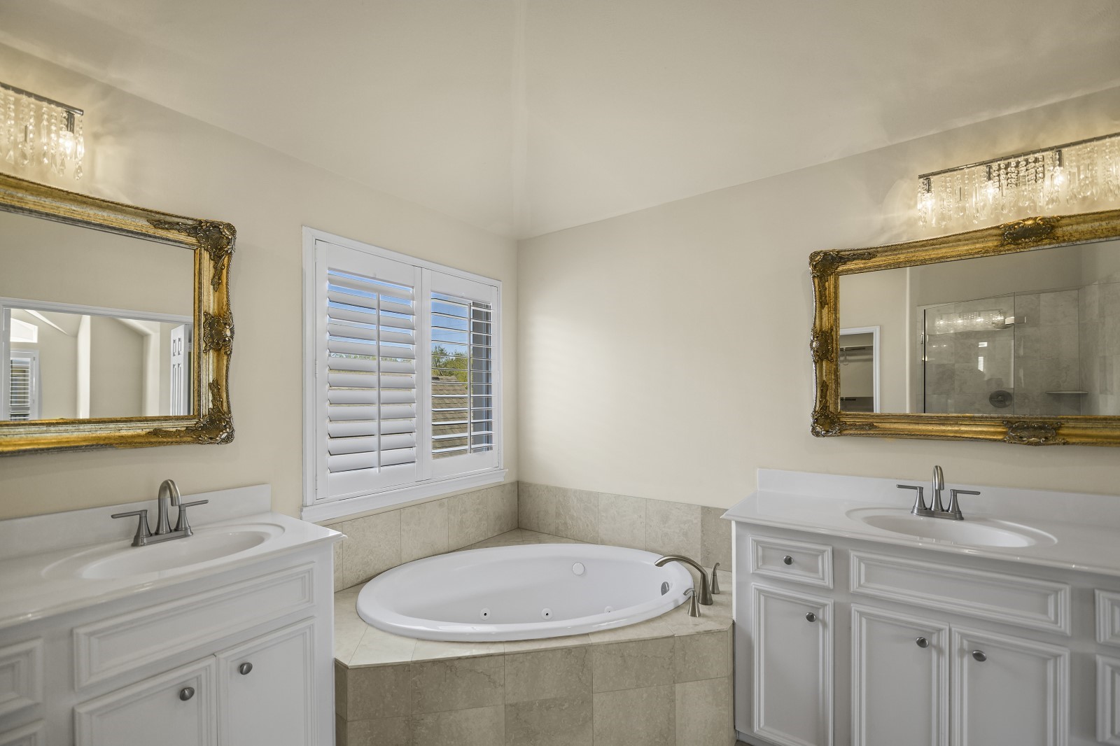 3307 West Lamar Street, Unit B Houston, TX 77019 - Photo 23 of 27 a bathroom with a sink double vanity granite tub and a mirror