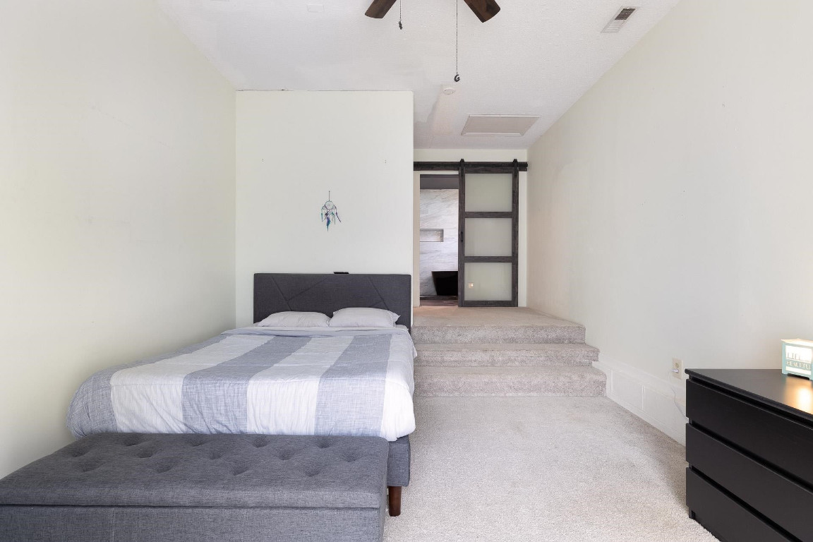 5006 Greenview Drive Durham, NC 27713 - Photo 14 of 34 a bedroom with a bed and a window