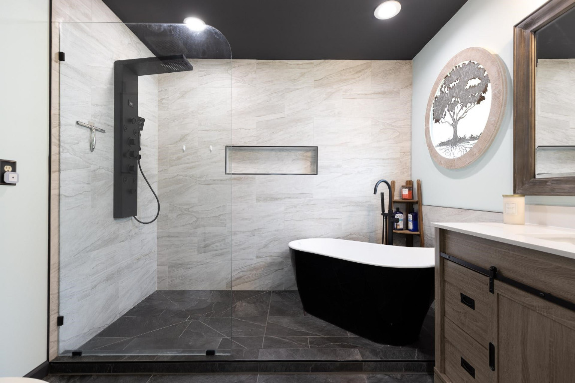 5006 Greenview Drive Durham, NC 27713 - Photo 17 of 34 a bathroom with a sink and a mirror