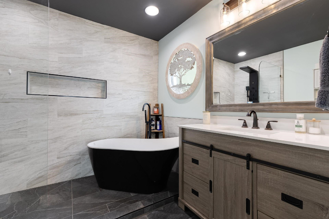 5006 Greenview Drive Durham, NC 27713 - Photo 18 of 34 a bathroom with a sink and a mirror