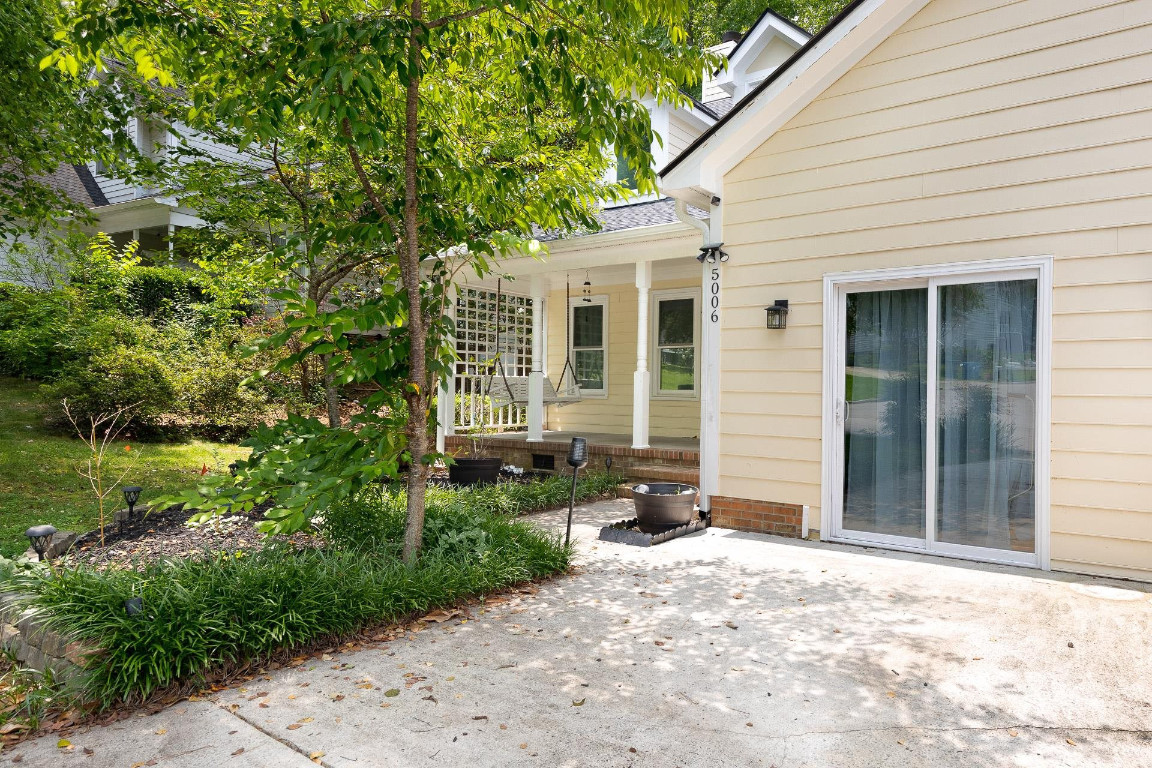 5006 Greenview Drive Durham, NC 27713 - Photo 2 of 34 a front view of a house with garden