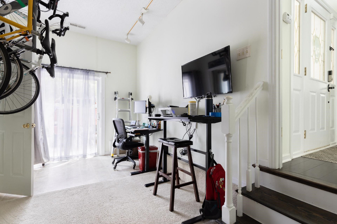 5006 Greenview Drive Durham, NC 27713 - Photo 21 of 34 a view of a livingroom with furniture and a flat screen tv
