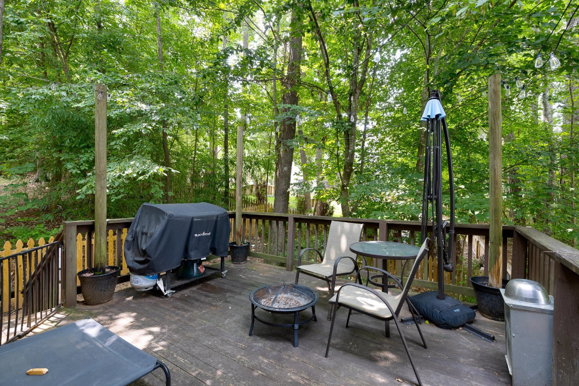 5006 Greenview Drive Durham, NC 27713 - Photo 33 of 34 a view of a chair and tables in the back yard of the house