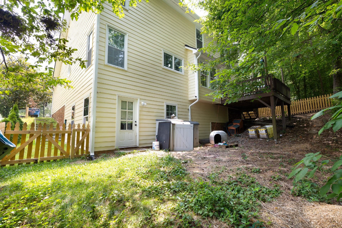 5006 Greenview Drive Durham, NC 27713 - Photo 34 of 34 a view of a backyard with chairs and a large tree