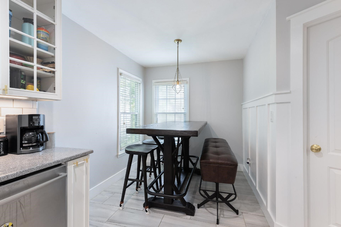 5006 Greenview Drive Durham, NC 27713 - Photo 9 of 34 a view of a dining room with furniture and window