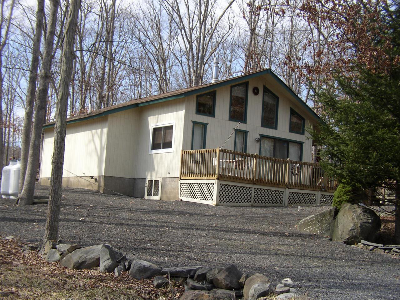 936 Decker Road Bushkill, PA 18324 - Photo 1 of 1 a house that has a tree in front of the house