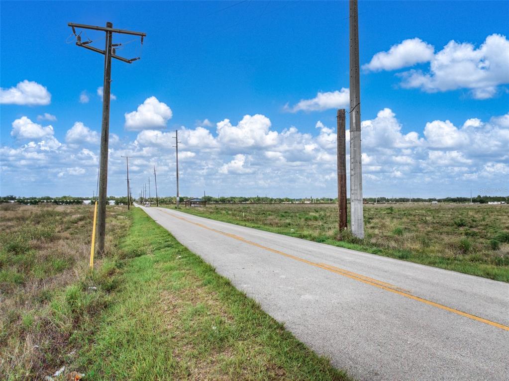 4199 Desoto City Road Sebring, FL 33870 - Photo 5 of 7 a view of a floor to ceiling window and a yard