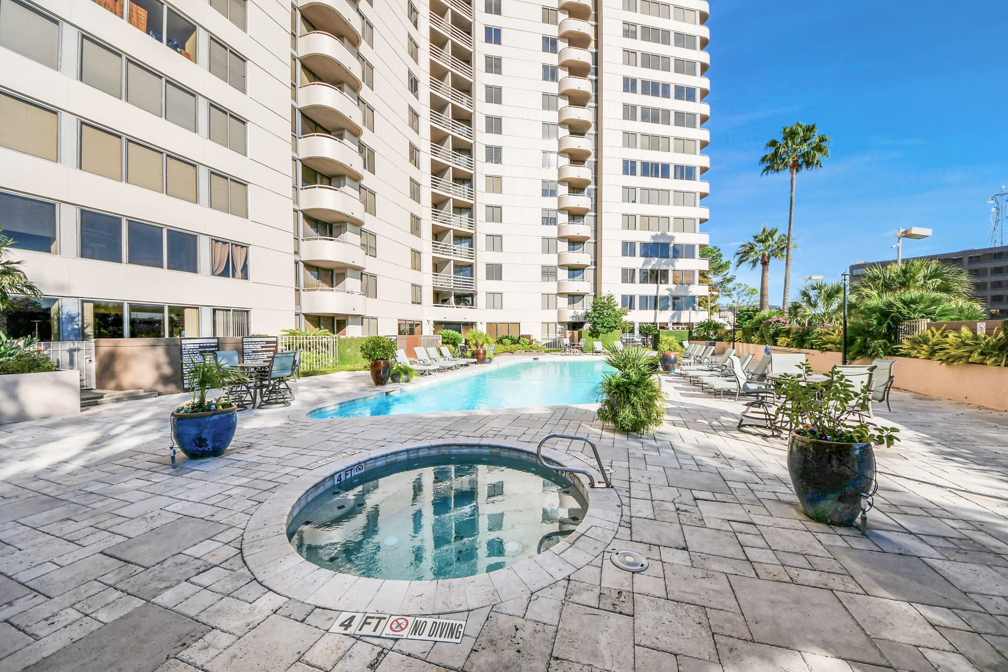 3525 Sage Road, Unit 1503 Houston, TX 77056 - Photo 16 of 50 a view of a swimming pool with outdoor seating