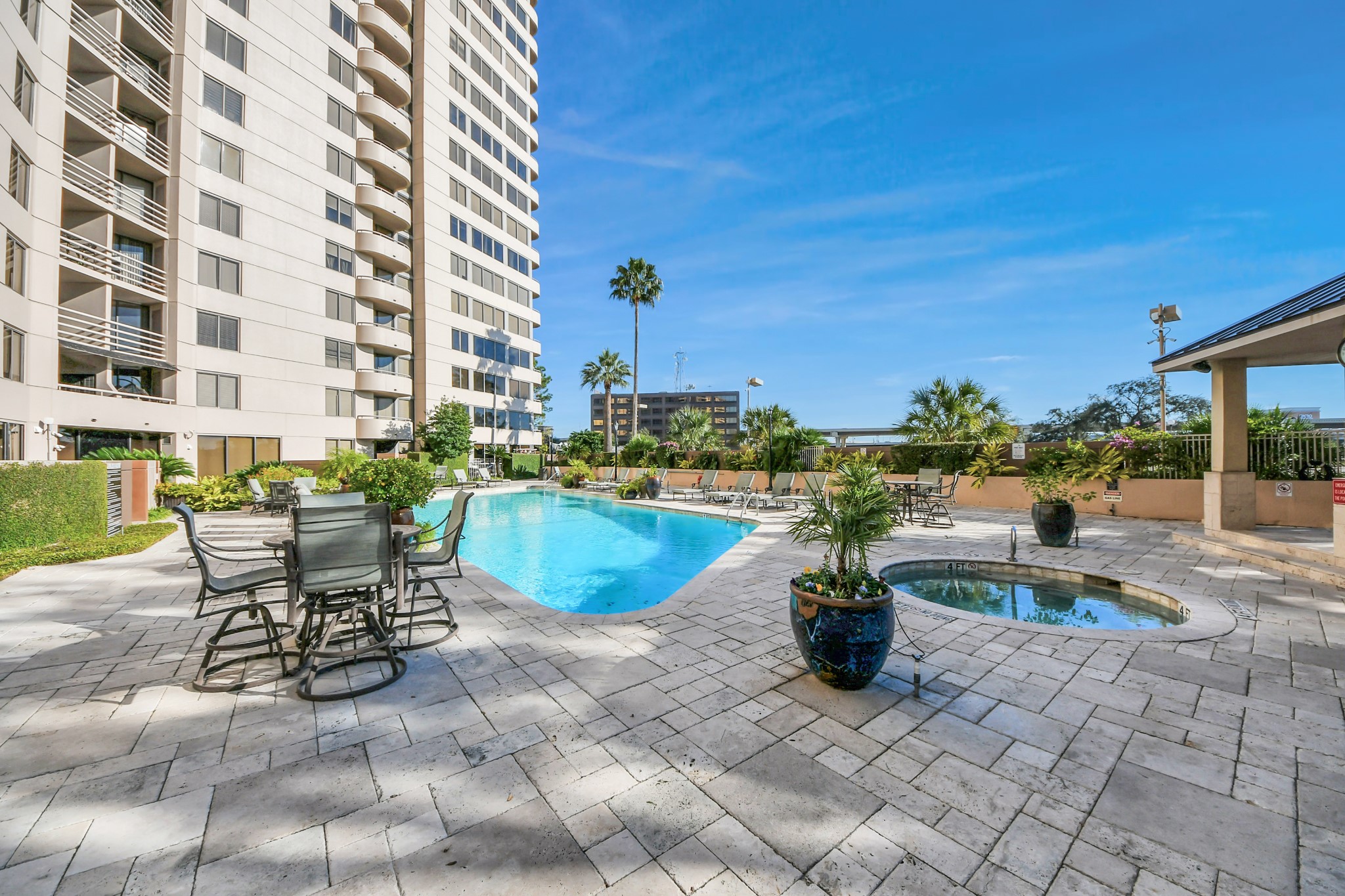 3525 Sage Road, Unit 1503 Houston, TX 77056 - Photo 17 of 50 a view of a swimming pool with a patio