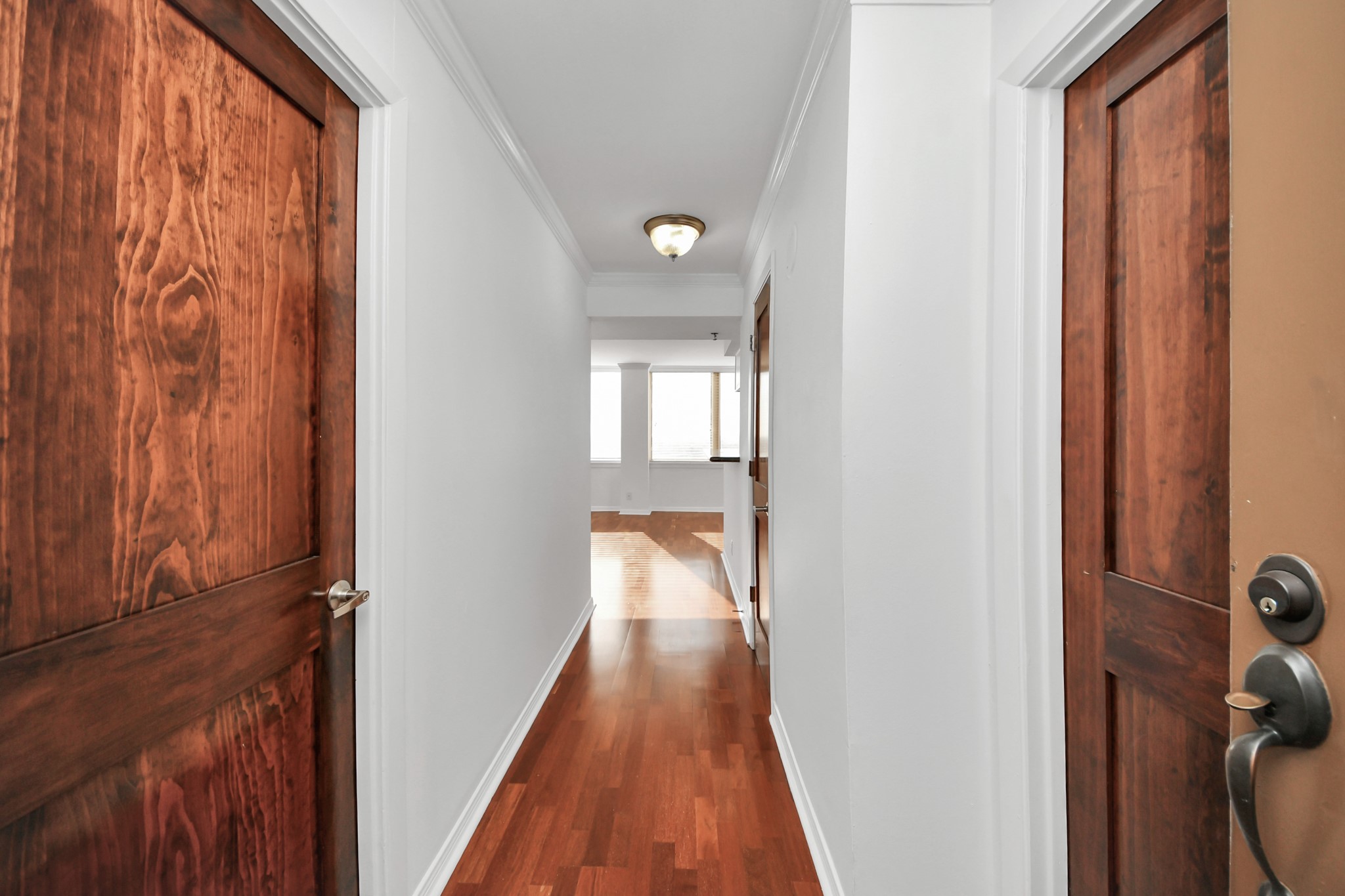 3525 Sage Road, Unit 1503 Houston, TX 77056 - Photo 20 of 50 a view of a hallway with wooden floor and staircase