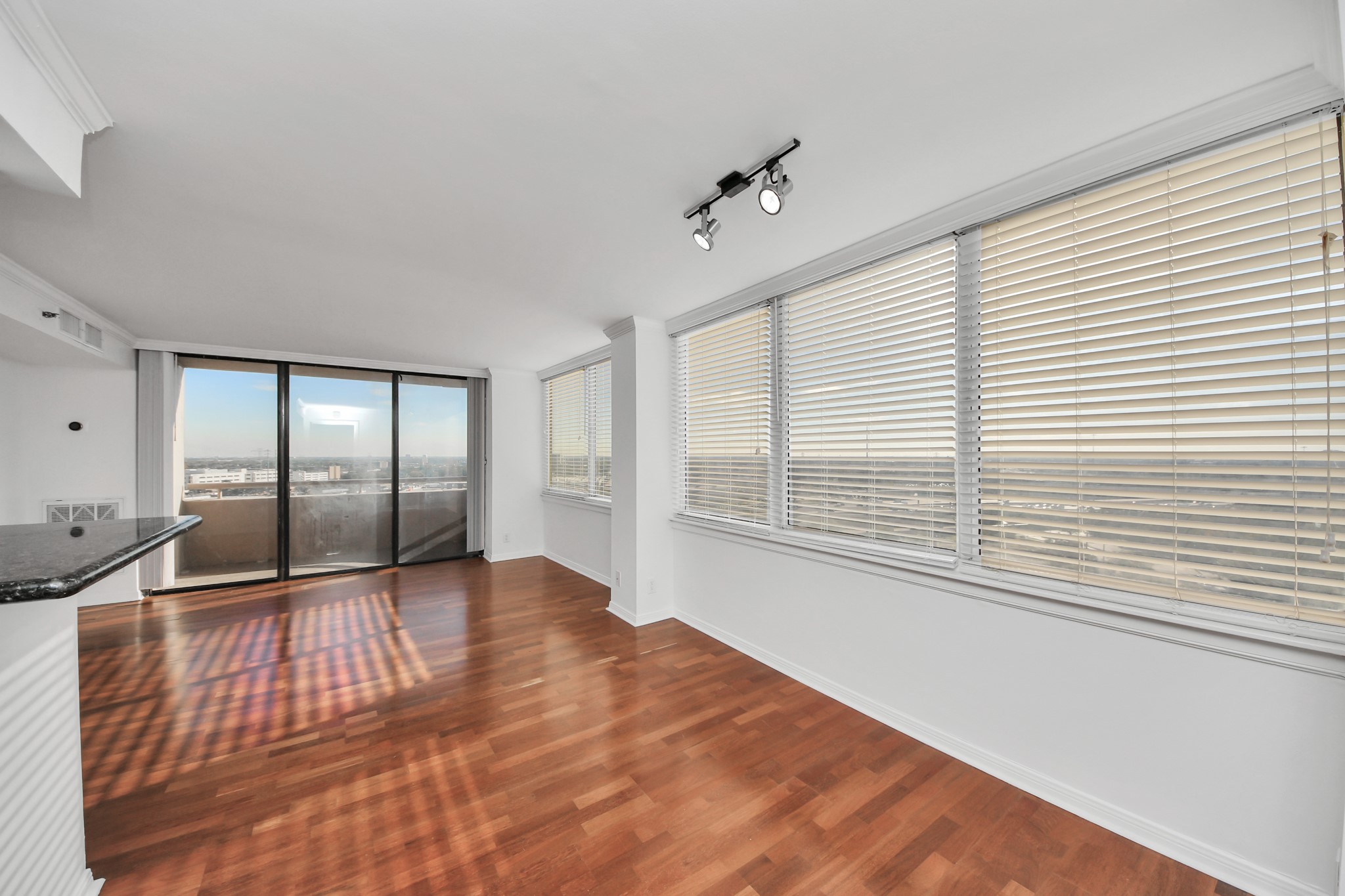 3525 Sage Road, Unit 1503 Houston, TX 77056 - Photo 23 of 50 a view of an empty room with wooden floor and a window