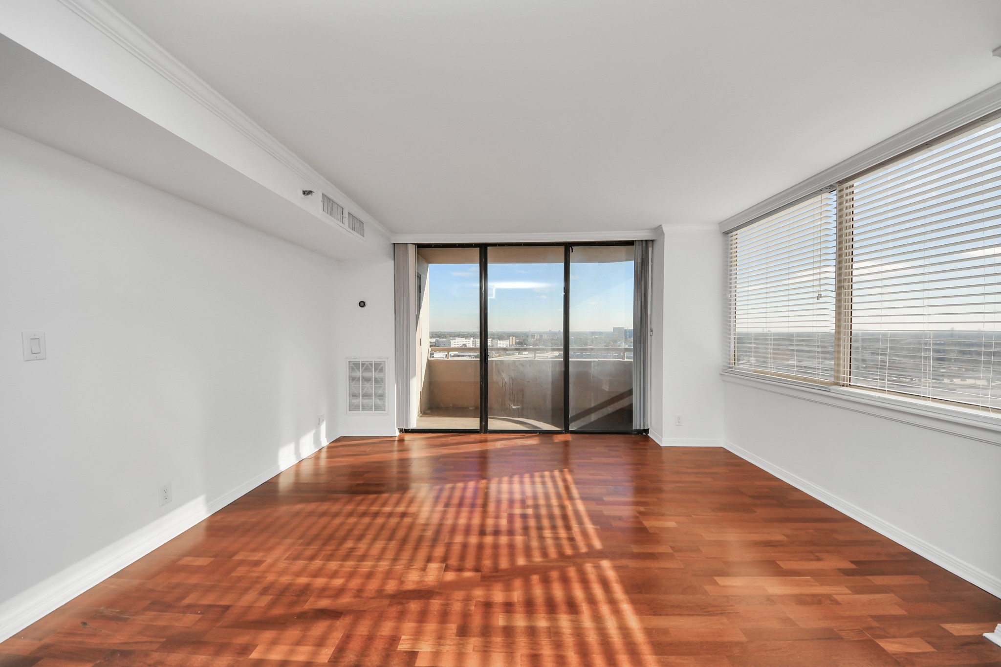 3525 Sage Road, Unit 1503 Houston, TX 77056 - Photo 28 of 50 a view of an empty room with wooden floor and a window