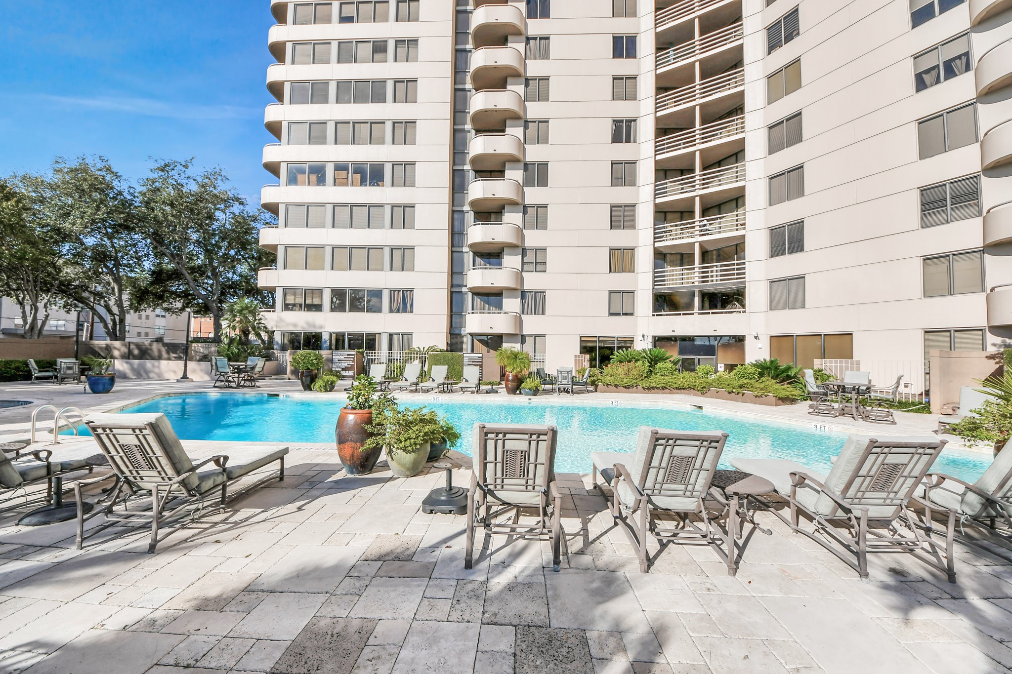 3525 Sage Road, Unit 1503 Houston, TX 77056 - Photo 3 of 50 a view of a swimming pool with outdoor seating