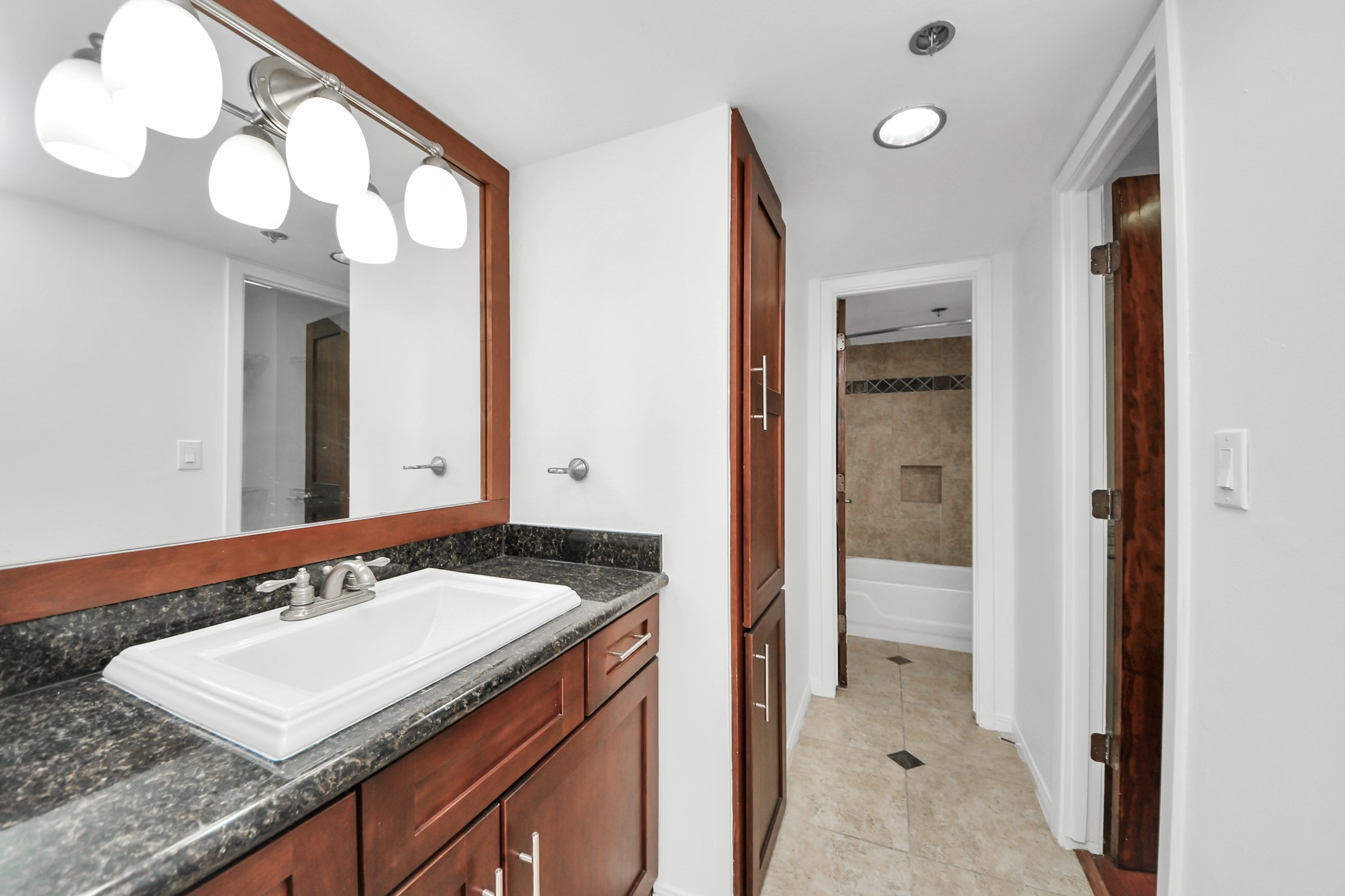 3525 Sage Road, Unit 1503 Houston, TX 77056 - Photo 44 of 50 a bathroom with a sink and a mirror