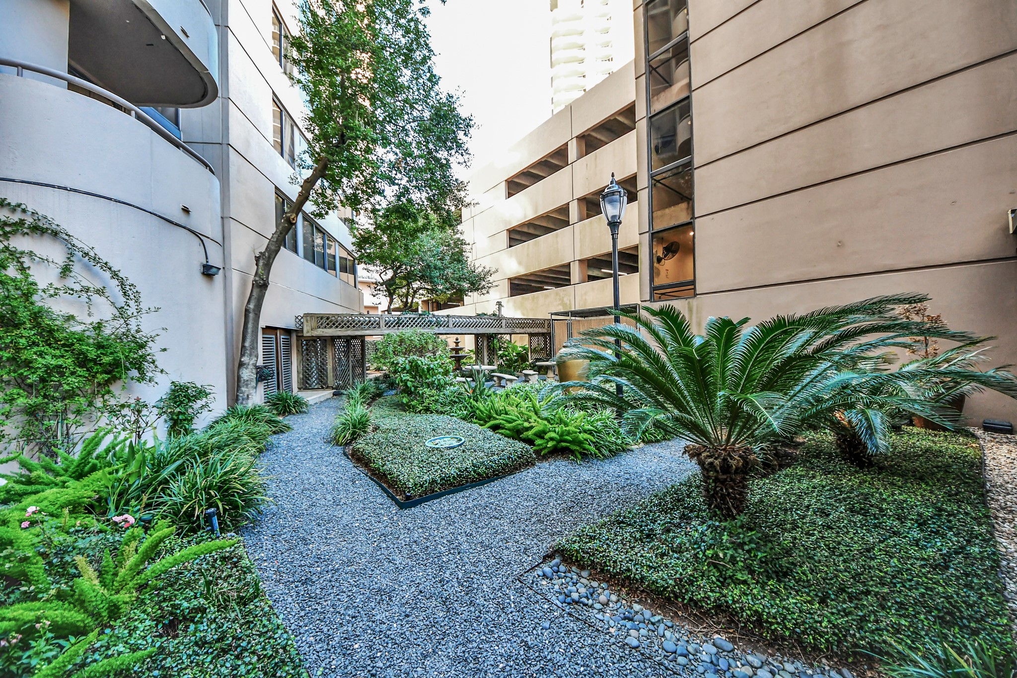 3525 Sage Road, Unit 1503 Houston, TX 77056 - Photo 47 of 50 a view of a garden with pathway