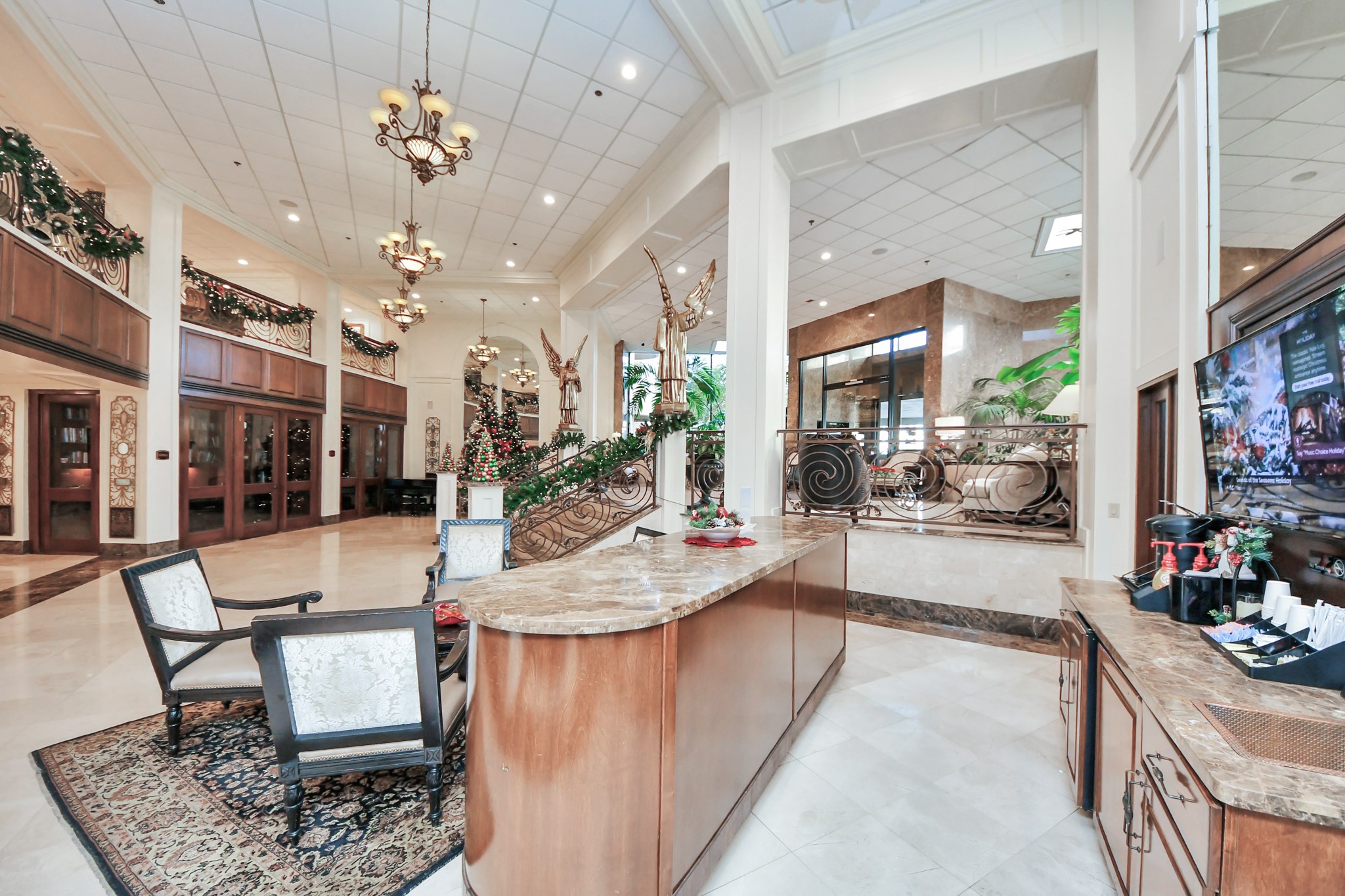 3525 Sage Road, Unit 1503 Houston, TX 77056 - Photo 7 of 50 a large living room with a chandelier dining table and chairs