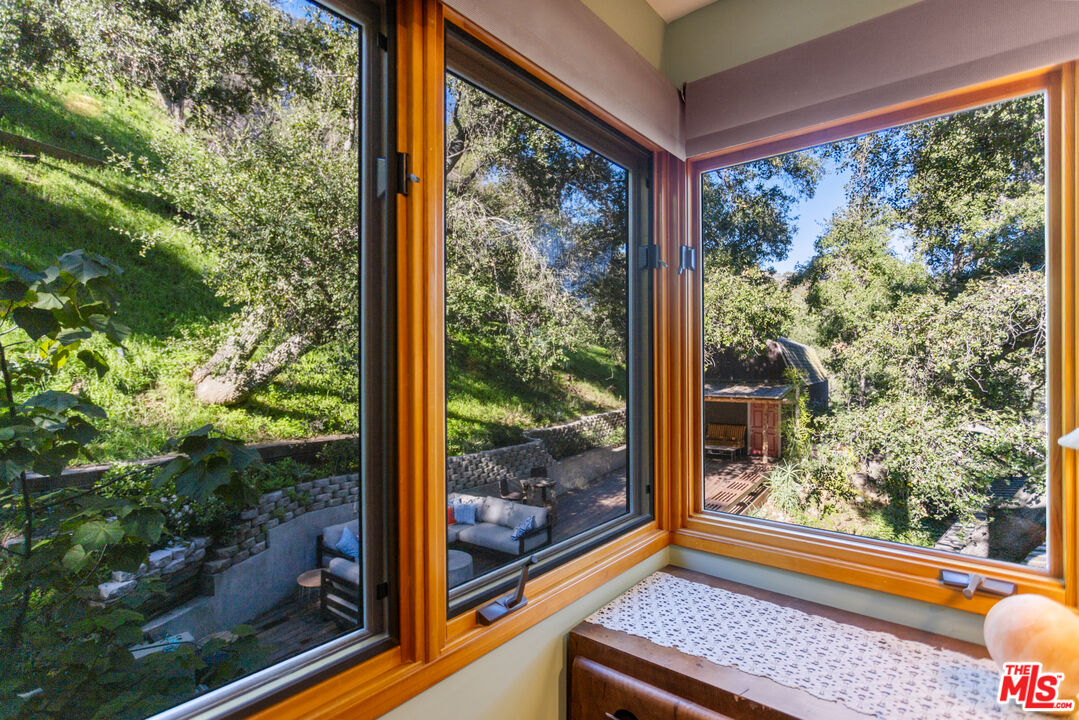 3217 Canon Place Topanga, CA 90290 - Photo 14 of 49 a view of a room with a large window and wooden floor