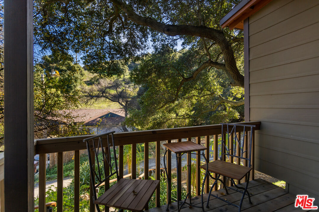 3217 Canon Place Topanga, CA 90290 - Photo 29 of 49 a view of a porch with a bench