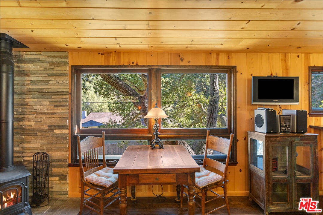 3217 Canon Place Topanga, CA 90290 - Photo 32 of 49 a dining room with furniture and window