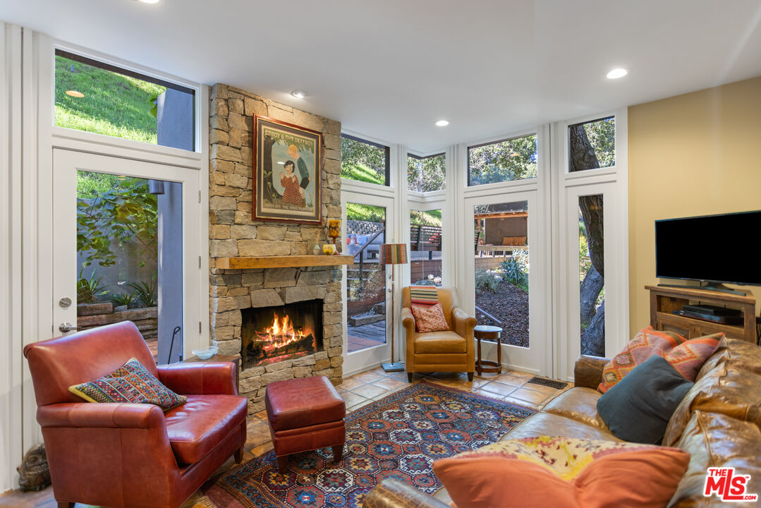 3217 Canon Place Topanga, CA 90290 - Photo 4 of 49 a living room with furniture fireplace and flat screen tv