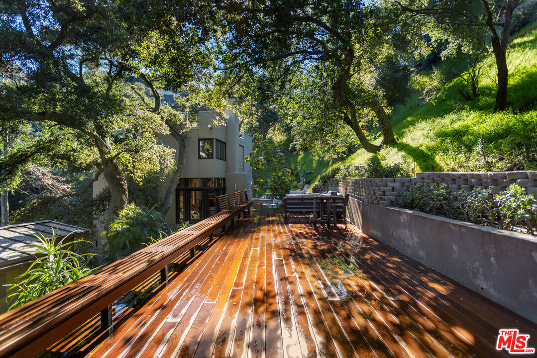 3217 Canon Place Topanga, CA 90290 - Photo 43 of 49 a view of balcony with wooden floor and outdoor seating