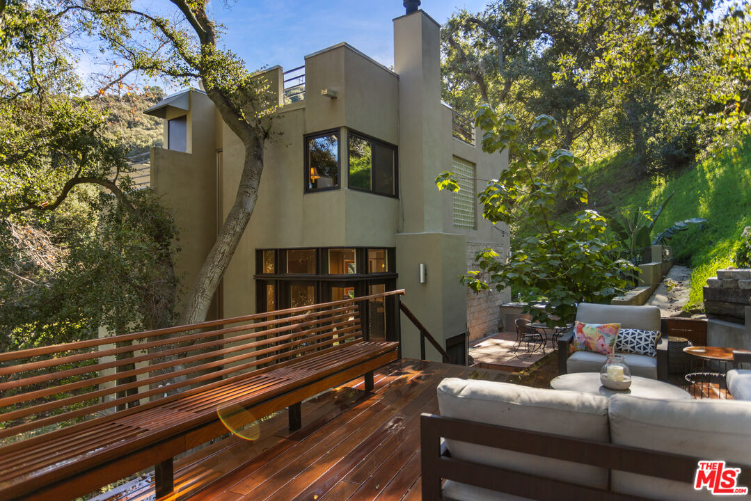 3217 Canon Place Topanga, CA 90290 - Photo 44 of 49 a view of a balcony with two chairs and a potted plant