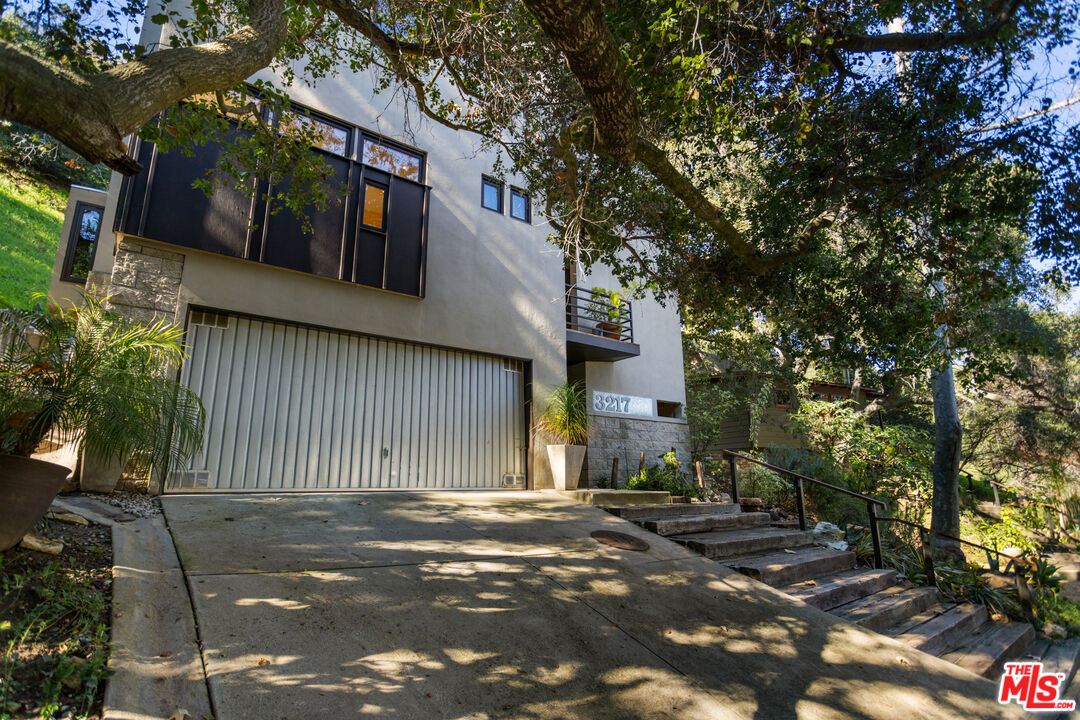 3217 Canon Place Topanga, CA 90290 - Photo 45 of 49 a front view of a house with a tree