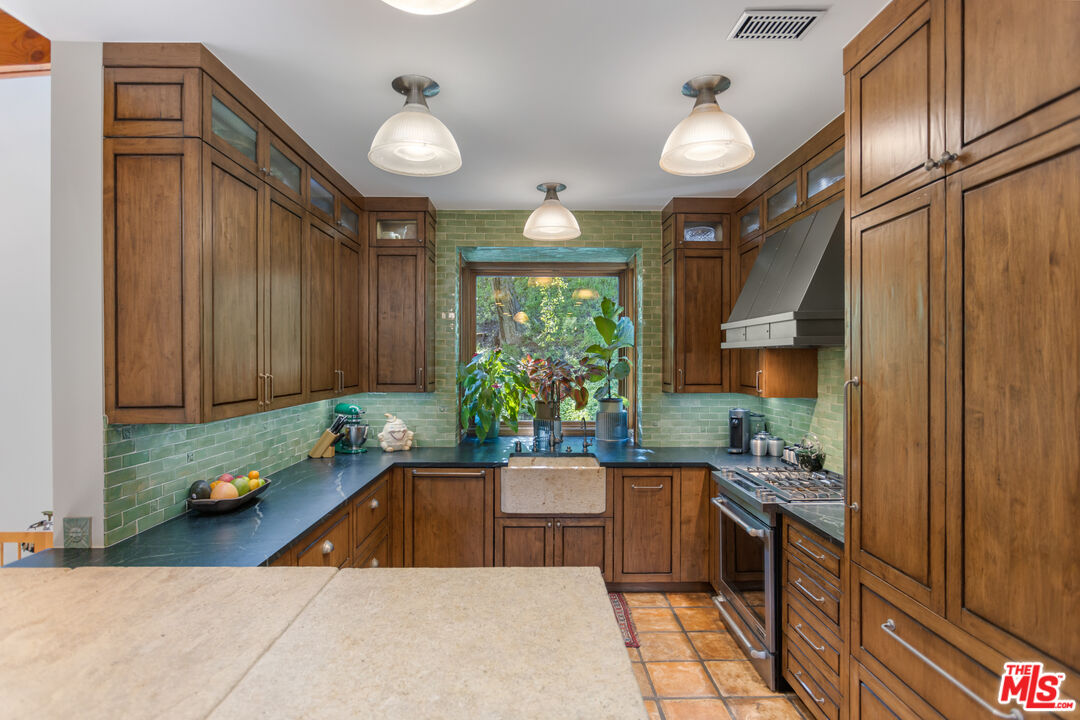 3217 Canon Place Topanga, CA 90290 - Photo 9 of 49 a kitchen that has a sink and a stove in it