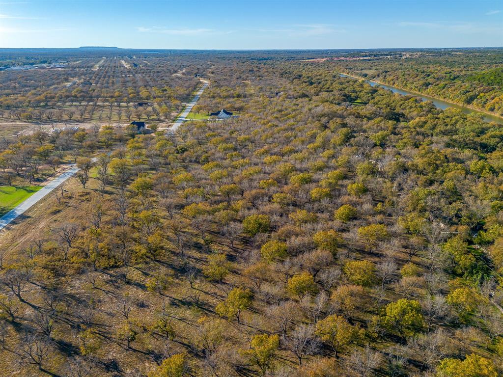 3030 West Landings Road North Granbury, TX 76049 - Photo 6 of 33 an aerial view of residential building and green space