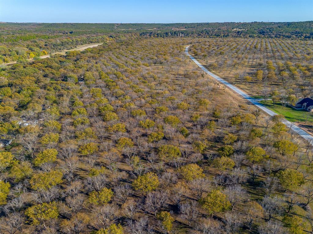 3030 West Landings Road North Granbury, TX 76049 - Photo 10 of 33 a view of a lake with a mountain