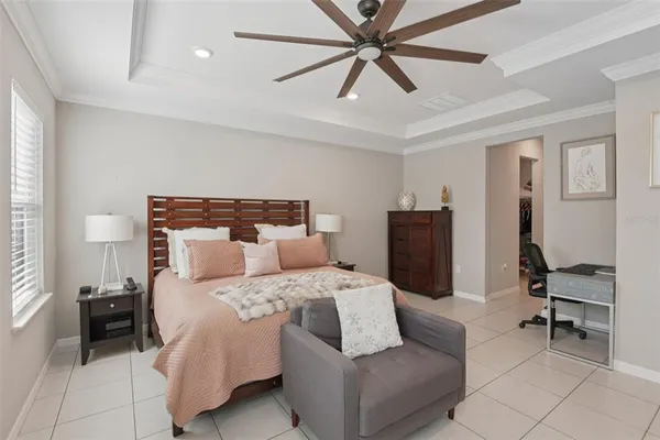 a bedroom with a bed and a chair