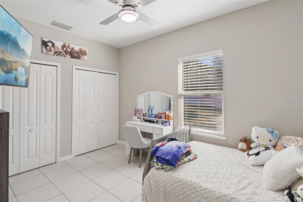 21 Mayten Court North Homosassa, FL 34446 - Photo 16 of 37 a bedroom with a bed and a window