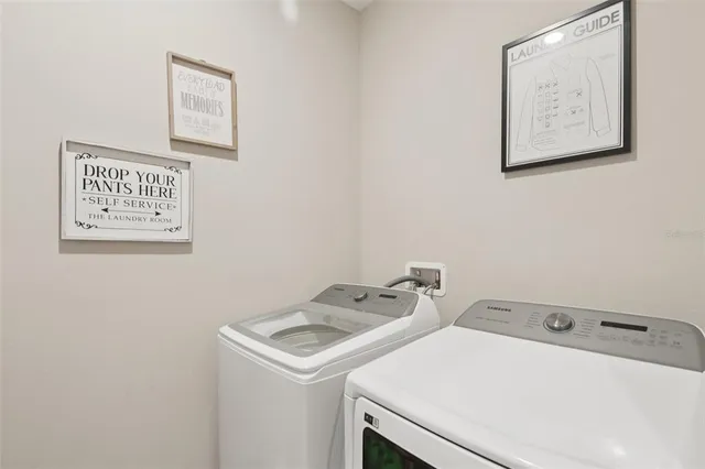 a utility room with dryer and washer