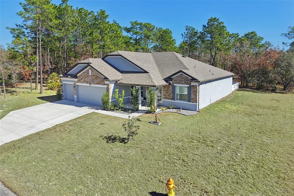 21 Mayten Court North Homosassa, FL 34446 - Photo 31 of 37 a house view with a garden space