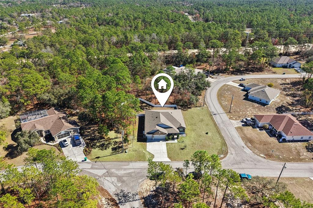 21 Mayten Court North Homosassa, FL 34446 - Photo 34 of 37 an aerial view of a swimming pool with outdoor seating