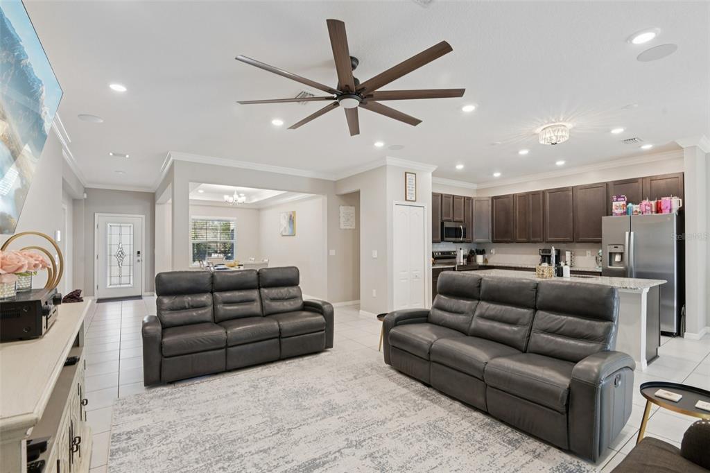 21 Mayten Court North Homosassa, FL 34446 - Photo 7 of 37 a living room with furniture ceiling fan and a wooden floor