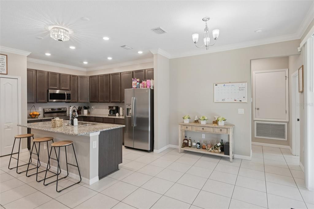 21 Mayten Court North Homosassa, FL 34446 - Photo 8 of 37 a kitchen with refrigerator and cabinets