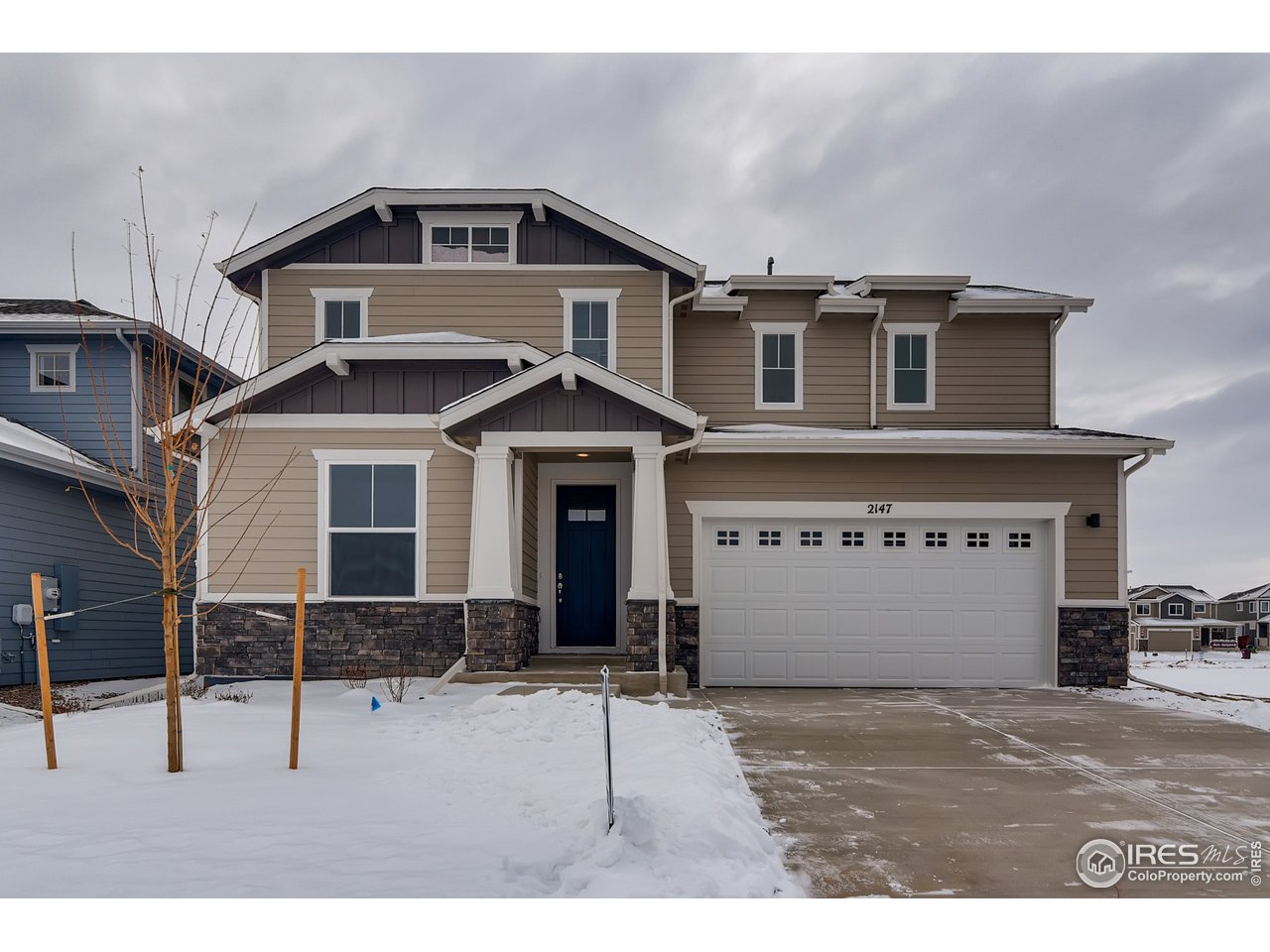 a front view of a house with a garage