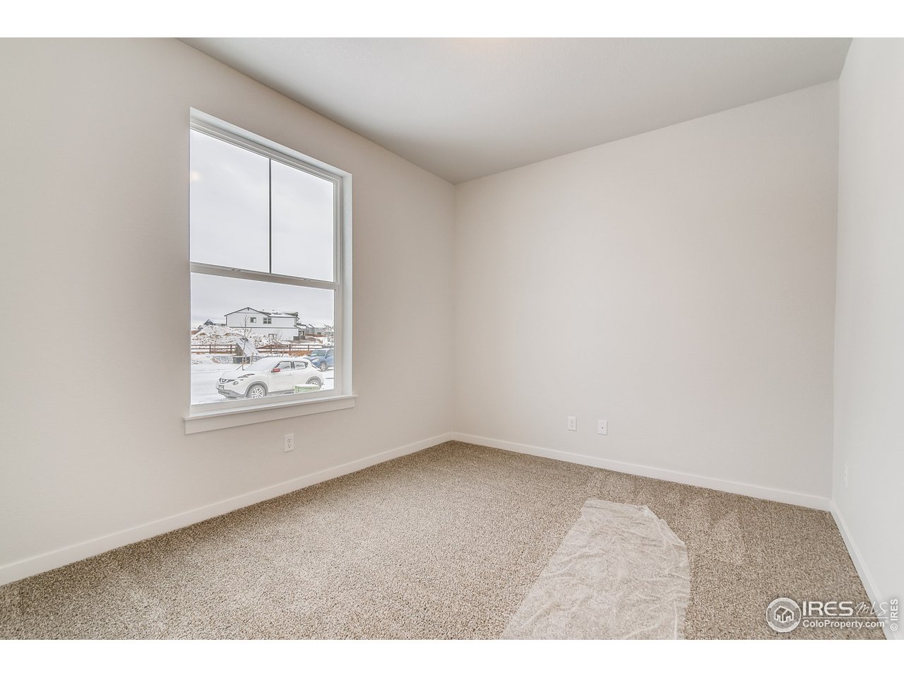 2147 Gather Drive Windsor, CO 80550 - Photo 14 of 28 an empty room with windows