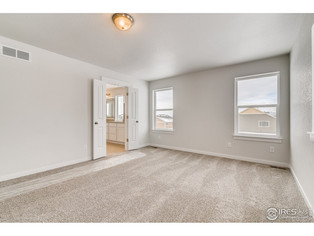 2147 Gather Drive Windsor, CO 80550 - Photo 16 of 28 a view of an empty room with a window