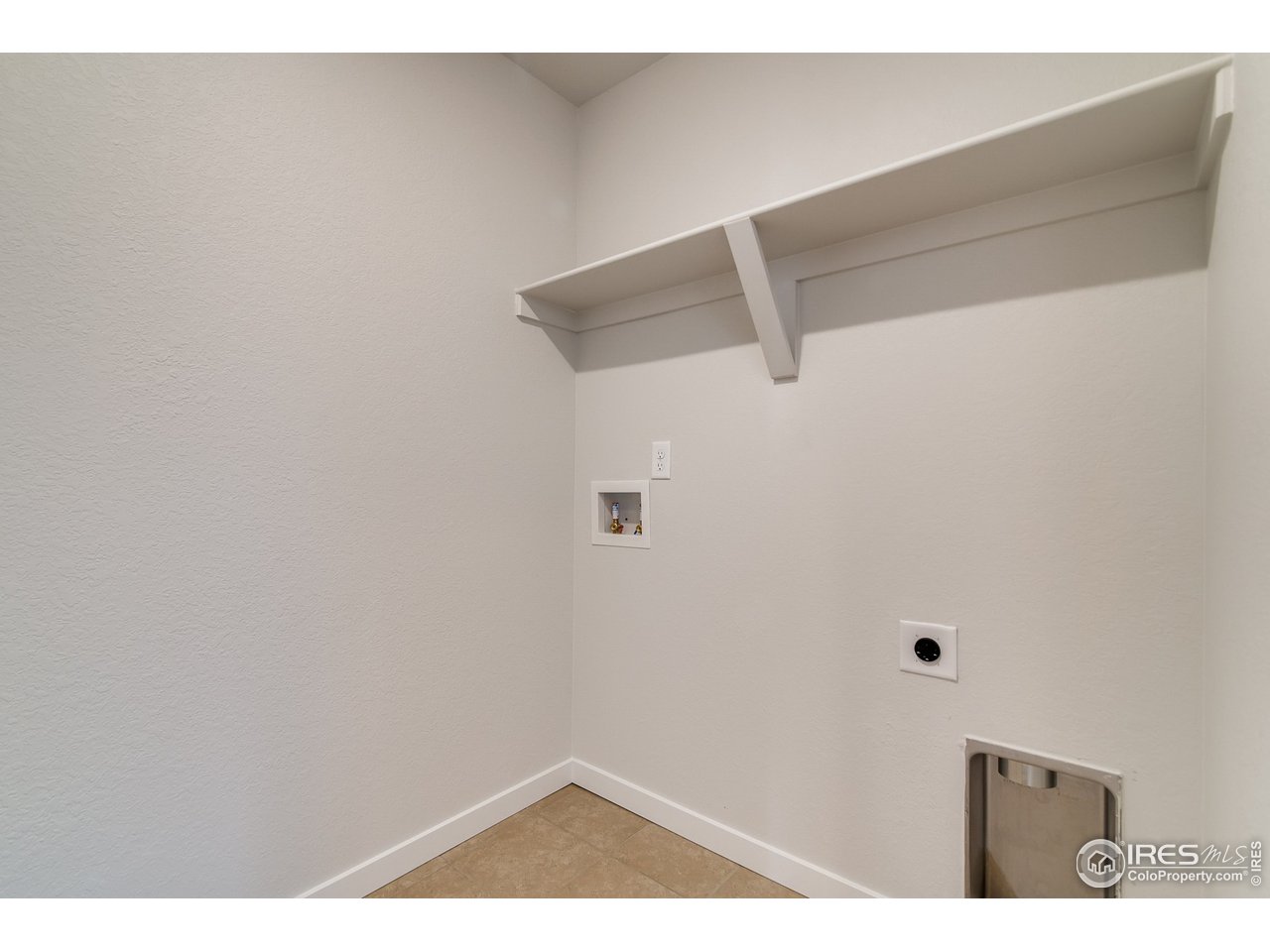 2147 Gather Drive Windsor, CO 80550 - Photo 25 of 28 a view of small space with racks on the wall