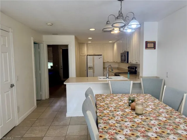 a kitchen with a sink stove and microwave