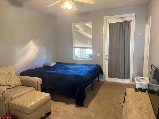 a kitchen with kitchen island stainless steel appliances a sink stove and refrigerator