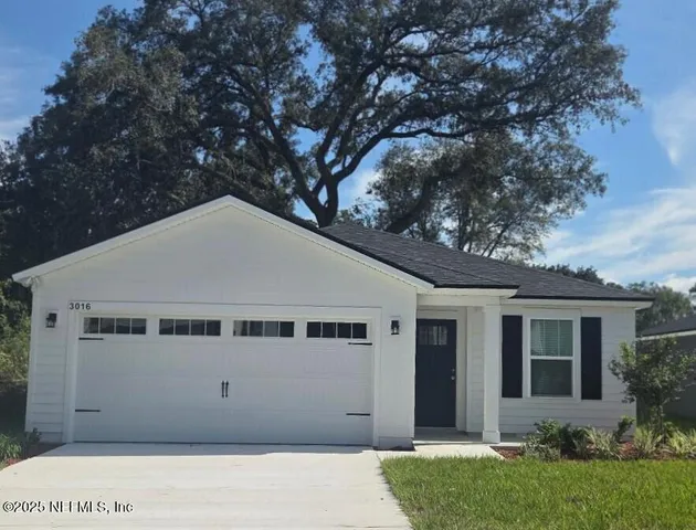 a house with trees in front of it