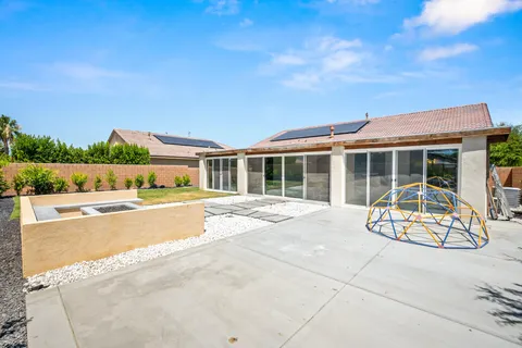 an aerial view of residential houses with city view