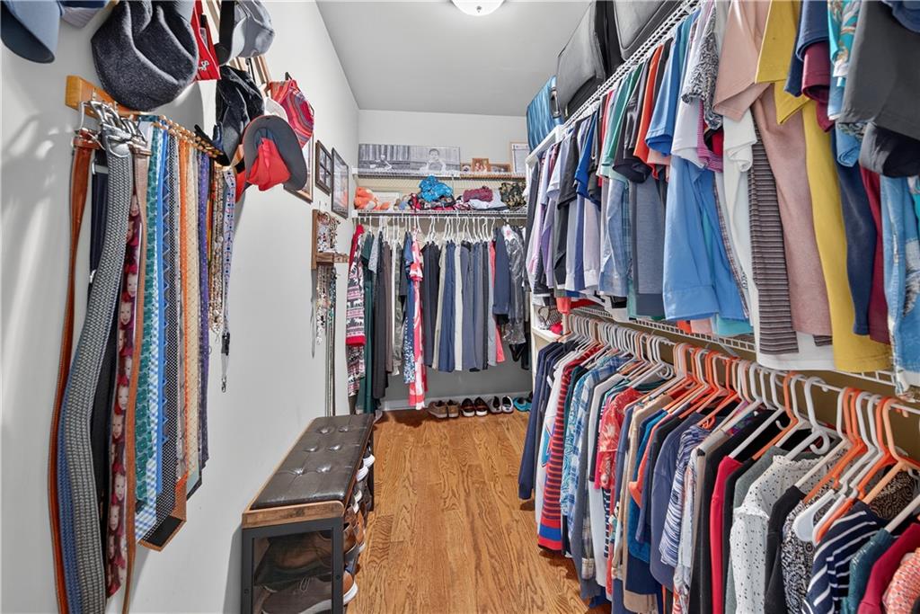 5250 Kendalls Way Cumming, GA 30041 - Photo 20 of 42 a view of walk in closet with clothes