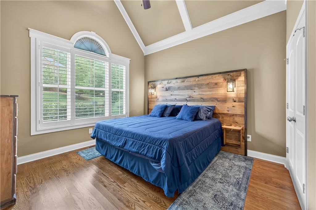 5250 Kendalls Way Cumming, GA 30041 - Photo 22 of 42 a bed sitting in a bedroom next to a window